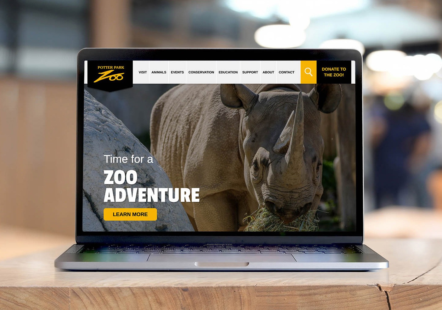 Potter Park Zoo Homepage on a laptop