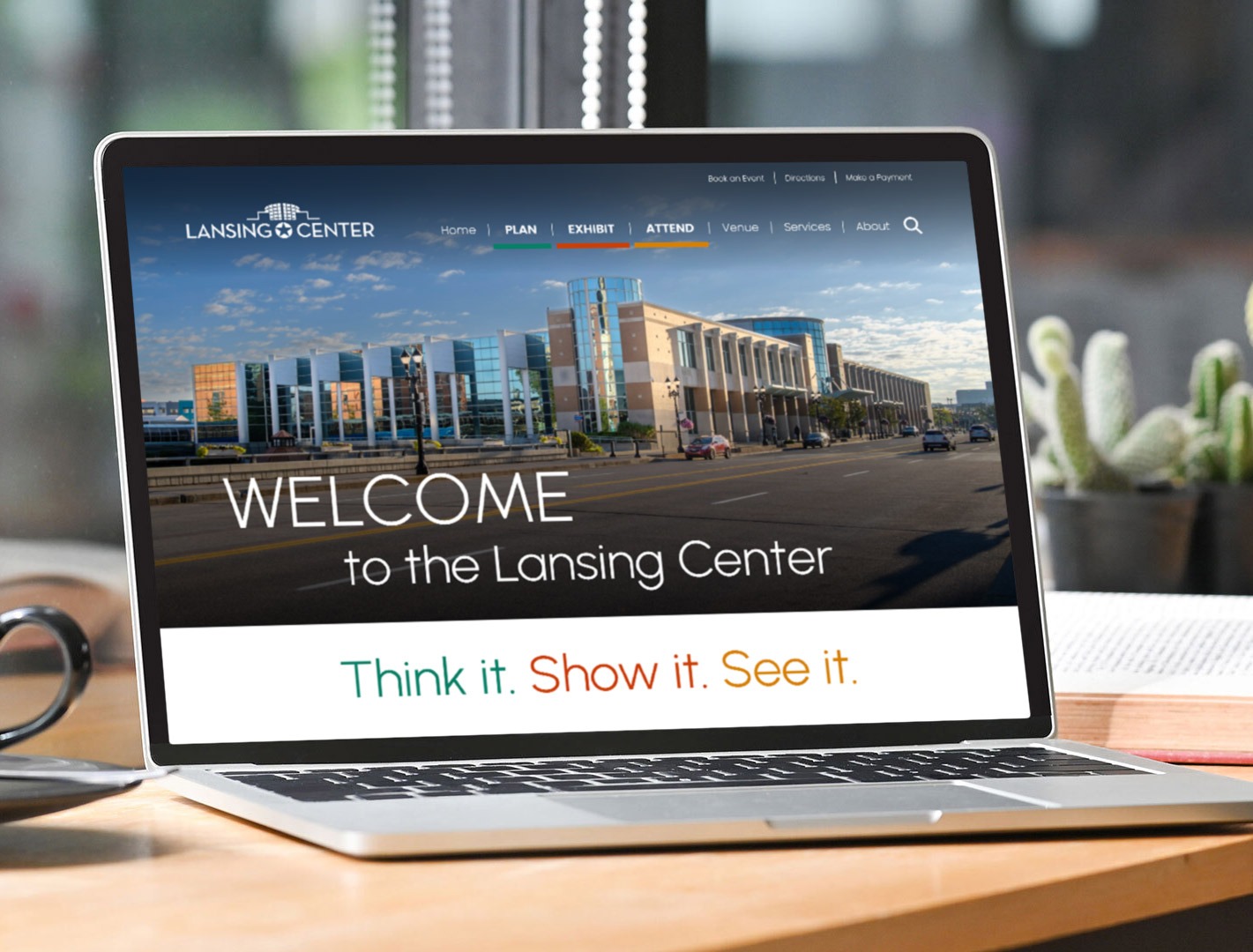 Lansing Center website on a laptop