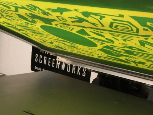 Close up of silk screen printing process for posters