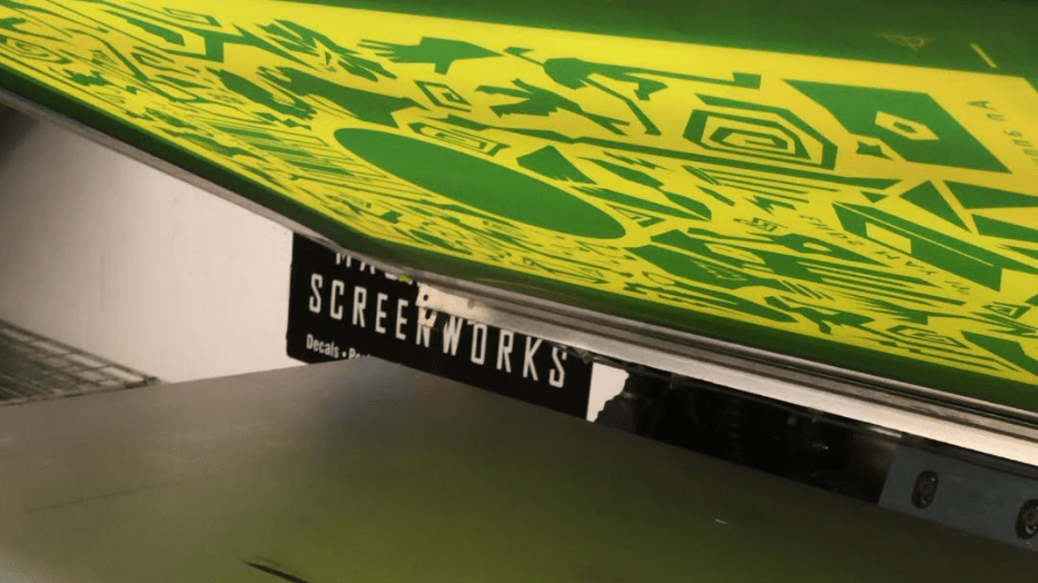 Close up of silk screen printing process for posters